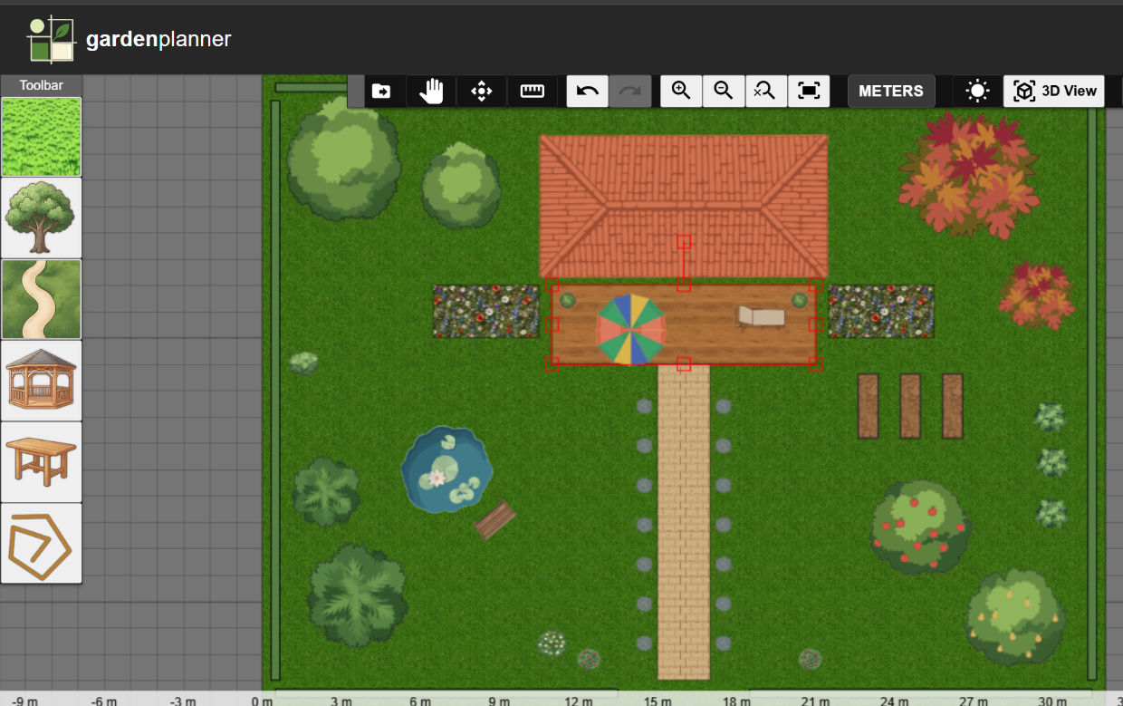 2D garden plan in Garden Planner: a house with a wooden terrace, a paved path lined with lavender, a pond with a bench, raised vegetable beds, fruit trees and a hedge around the garden